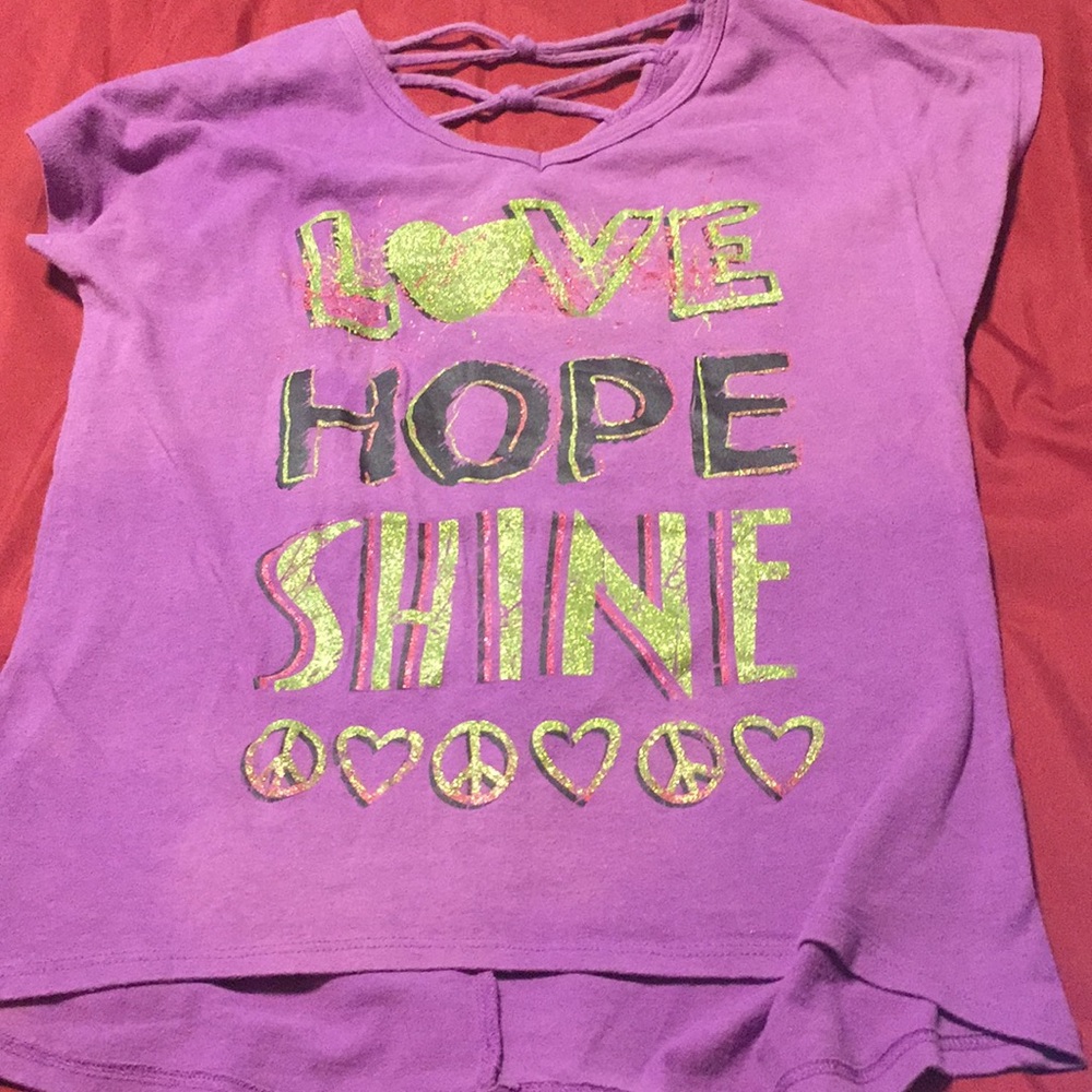 love, hope, shine” shirt with a slightly open back